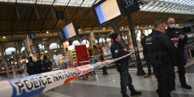 French police cordon off an area at Paris' Gare du Nord train station, after a knife-wielding suspect injured six people, including a police officer, at the Gare du Nord train station in Paris on Jan. 11, 2023.