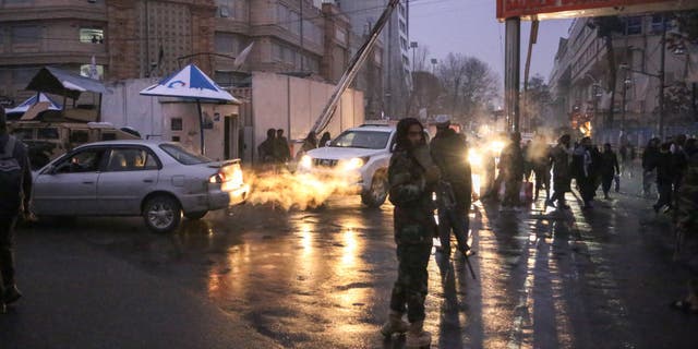 Police take security measures with casualties feared after a huge explosion and gunfire were reported outside Afghanistan's Foreign Ministry building in the capital Kabul, Afghanistan, Jan. 11, 2023.