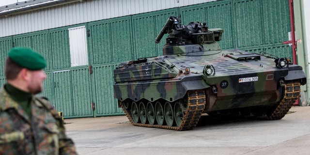 Soldiers of the Panzergrenadierbrigade 37 mechanized infantry unit of the Bundeswehr demonstrate the capabilities of the Marder infantry fighting vehicle (Schuetzenpanzer Marder) during a visit by German Defense Minister Christine Lambrecht on December 12, 2022 in Marienberg, Germany. 