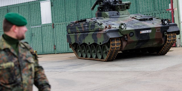 Soldiers of the Panzergrenadierbrigade 37 mechanized infantry unit of the Bundeswehr demonstrate the capabilities of the Marder infantry fighting vehicle (Schuetzenpanzer Marder) during a visit by German Defense Minister Christine Lambrecht on December 12, 2022 in Marienberg, Germany. 