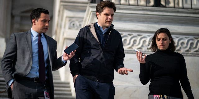 Rep. Matt Gaetz, R-Fla., talks with reporters as they walk down the steps at the U.S. Capitol on Jan. 12, 2023.