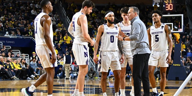 Northwestern Wildcats head coach Chris Collins talks to his team during a timeout during the Michigan Wolverines versus the Northwestern Wildcats game on Sunday January 15, 2023 at Crisler Center in Ann Arbor, MI.