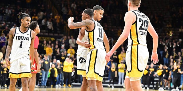 Iowa players celebrate on the court after winning a college basketball game between the Maryland Terrapins and the Iowa Hawkeyes on January 15, 2023 at Carver-Hawkeye Arena in Iowa City, IA 