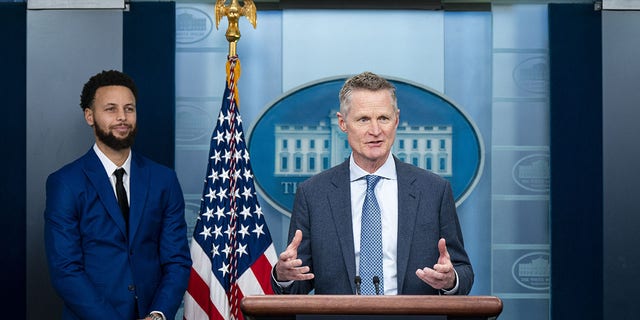 Steve Kerr, head coach of the NBA's Golden State Warriors, speaks during a press conference with player Stephen Curry, left, in the James S. Brady Press Briefing Room at the White House in Washington, DC , on Tuesday, January 17, 2023.  