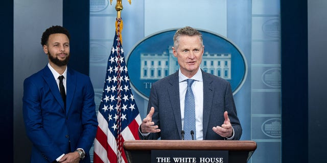 Steve Kerr, head coach of the NBA's Golden State Warriors, speaks during a press conference with player Stephen Curry, left, in the James S. Brady Press Briefing Room at the White House in Washington, DC , on Tuesday, January 17, 2023.  