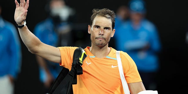Rafael Nadal waves after his match against Mackenzie McDonald at the Australian Open in Melbourne on January 18, 2023.