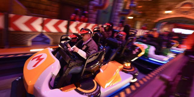 Guests ride Super Mario Kart during a preview of Super Nintendo World at Universal Studios on January 13, 2023 in Los Angeles, California.