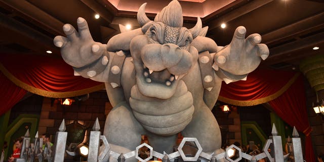 A statue of Bowser is seen at the entrance to the Mario Kart Bowser's Challenge ride during a preview of Super Nintendo World at Universal Studios on January 13, 2023 in Los Angeles, California.