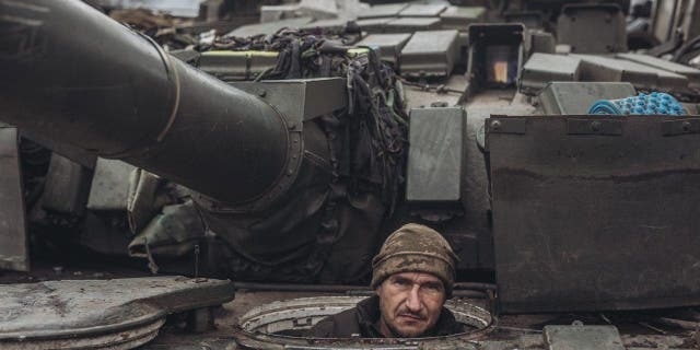 A Ukrainian soldier drives a tank on the Donbass frontline as military mobility continues within the Russian-Ukrainian war on January 18, 2023. (Photo by Diego Herrera Carcedo/Anadolu Agency via Getty Images)