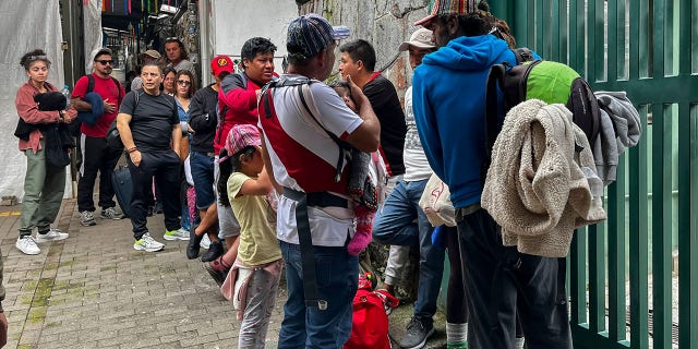 Tourists wait outside the Machu Picchu train station after the railway service was suspended due to damages allegedly caused by protesters in Machu Picchu, Peru, on January 21, 2023.