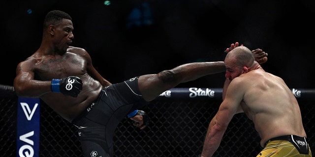 Brazilian Glover Teixera (R) competes against US Jamahal Hill during their light heavyweight title bout at the Ultimate Fighting Championship (UFC) event at the Jeunesse Arena in Rio de Janeiro, Brazil, on Jan. 21, 2023.