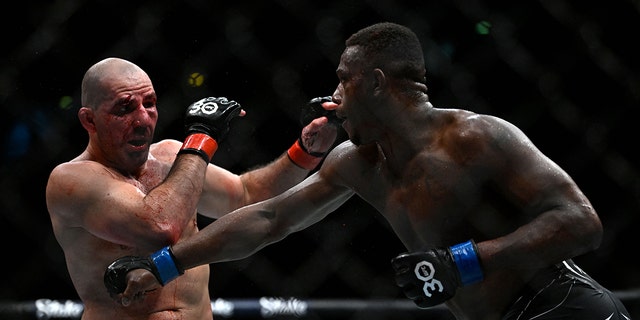 Brazilian Glover Teixera (L) competes against US Jamahal Hill during their light heavyweight title bout at the Ultimate Fighting Championship (UFC) event at the Jeunesse Arena in Rio de Janeiro, Brazil, on Jan. 21, 2023. 