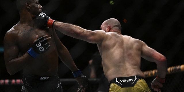 Brazilian Glover Teixera (right) competes against American Jamahal Hill during their light heavyweight title fight at the Ultimate Fighting Championship (UFC) event at Jeunesse Arena in Rio de Janeiro, Brazil on January 21, 2023. 