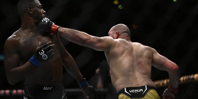 Brazilian Glover Teixera (R) competes against US Jamahal Hill during their light heavyweight title bout at the Ultimate Fighting Championship (UFC) event at the Jeunesse Arena in Rio de Janeiro, Brazil, on Jan. 21, 2023.