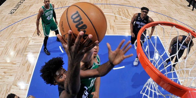Jonathan Isaac, #1 of the Orlando Magic, drives to the basket during the game against the Boston Celtics on January 23, 2023 at the Amway Center in Orlando, Florida. 