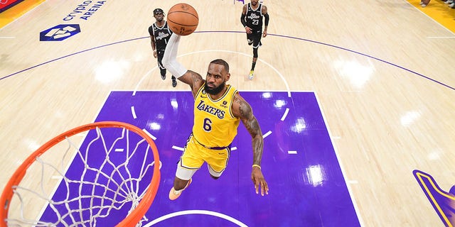 LeBron James of the Lakers drives to the basket against the Clippers on Jan. 24, 2023, at Crypto.Com Arena in Los Angeles.