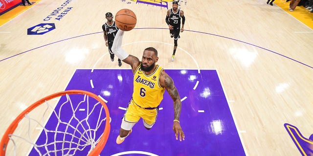 LeBron James of the Lakers drives to the basket against the Clippers on Jan. 24, 2023, at Crypto.Com Arena in Los Angeles.