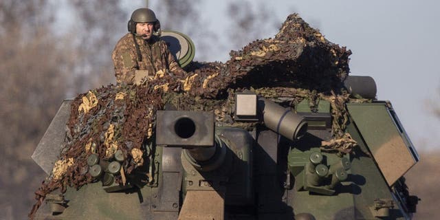 Ukrainian soldiers are seen on armored military vehicles as the strikes continue on the Donbass frontline in Donetsk Oblast, Ukraine, on Jan. 24, 2023.