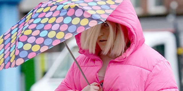 Isla Bryson, 31, formerly known as Adam Graham, from Clydebank, West Dunbartonshire, arrives at the High Court in Glasgow.