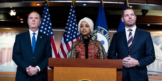 Reps. Adam Schiff, D-Calif., Ilhan Omar, D-Minn., and Eric Swalwell, D-Calif., behaviour a news convention astir being removed from committee assignments Jan. 25, 2023. 