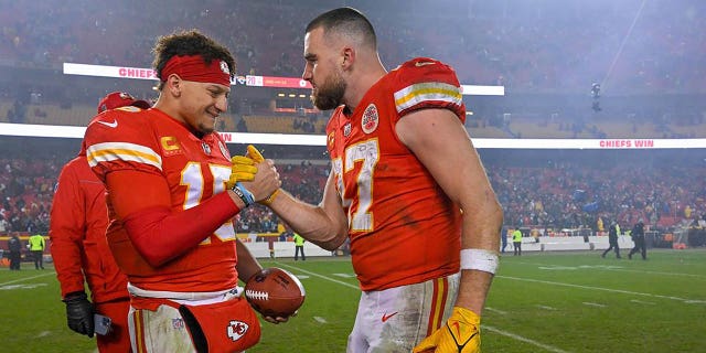 Kansas City Chiefs quarterback Patrick Mahomes, left, and tight end Travis Kelce celebrate a win over Jacksonville in the Divisional Round of the playoffs on Saturday, Jan. 21, 2023, at GEHA Field at Arrowhead Stadium in Kansas City, Missouri.
