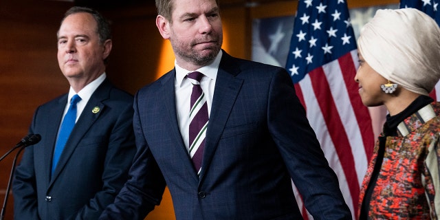 Rep.  Eric Swalwell, D-Calif., center, Adam Schiff, D-Calif., and Ilhan Omar, D-Minn., conduct a news conference on being removed from committees assignments, in the Capitol Visitor Center on Wednesday, January 25, 2023 . 