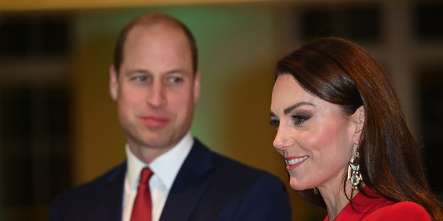 Meanwhile, as Kate Middleton, right, radiated in red, the internet could not help but notice the way Prince William proudly supported his wife in photos.