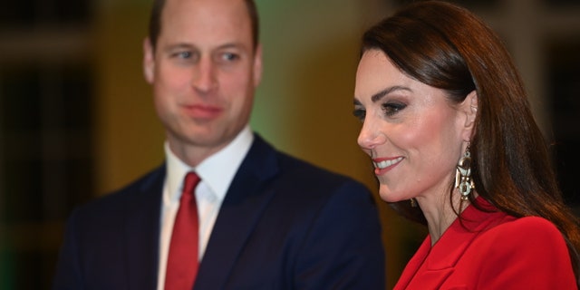 Meanwhile, as Kate Middleton, right, radiated in red, the internet could not help but notice the way Prince William proudly supported his wife in photos.