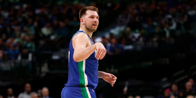 Luka Doncic, number 77 of the Dallas Mavericks, gestures after scoring a three-point basket against the Detroit Pistons in the first half at the American Airlines Center on January 30, 2023 in Dallas.
