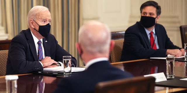 President Biden, left, and Chief of Staff Ron Klain meet with cabinet members and immigration advisors in the State Dining Room on March 24, 2021 in Washington, DC.