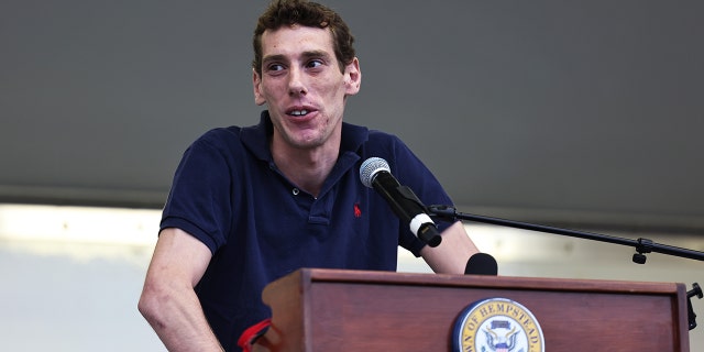 Joseph Borgen, a recent victim of a hate crime, speaks during a rally denouncing anti-Semitic violence on May 27, 2021 in Cedarhurst, New York.