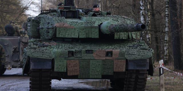 MUNSTER, GERMANY - FEBRUARY 07: A new Leopard 2 A7V heavy battle tank Bundeswehr's 9th Panzer Training Brigade stands during a visit by Defence Minister Christine Lambrecht to the Bundeswehr Army training grounds on February 07, 2022 in Munster, Germany.