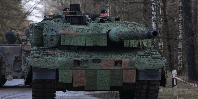 A new Leopard 2 A7V heavy battle tank, 9th Panzer Training Brigade of the Bundeswehr, stands during Defense Minister Christine Lambrecht's visit to the German Army's training ground on February 7, 2022, in Münster, Germany. 