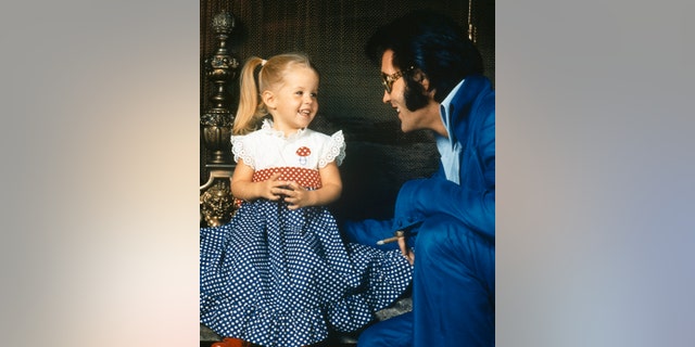 American rock legend Elvis Presley with his daughter Lisa-Marie Presley. 