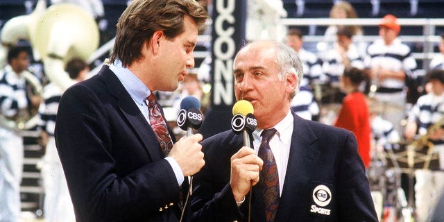 CBS college basketball broadcast commentators Jim Nantz (left) and Billy Packer on the court for a pregame analysis in Storrs, Connecticut in 1991. 