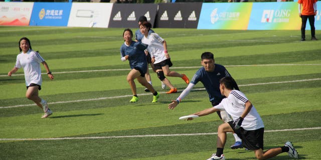 Team Xi'an Physical Education University V7 (in blue shirt) competes against Team Xi'an Terra-Cotta Warriors-RJM in the opener of China's first National Ultimate Frisbee League on Aug. 6, 2022, in Xi'an, Shaanxi Province.