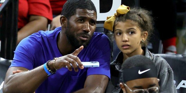 Major League Baseball player Dexter Fowler and his daughter Naya Fowler attend Game 1 of the 2022 WNBA Playoffs' first round at Michelob ULTRA Arena between the Phoenix Mercury and the Las Vegas Aces Aug. 17, 2022, in Las Vegas. The Aces defeated the Mercury 79-63.