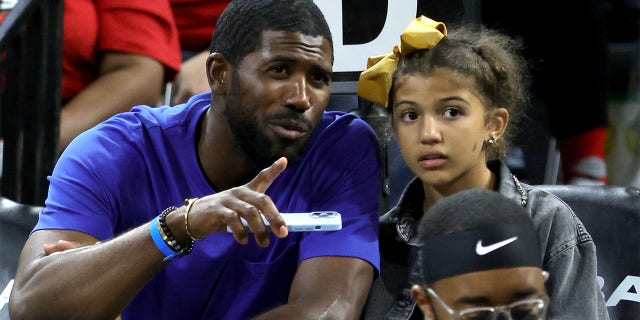 Major League Baseball player Dexter Fowler and his daughter Naya Fowler attend Game 1 of the 2022 WNBA Playoffs First Round between the Phoenix Mercury and Las Vegas Aces at Michelob Ultra Arena on August 17, 2022 in Las Vegas.  The Aces defeated the Mercury 79–63.  