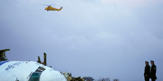 Officials examine the wreckage of Pan Am Flight 103 on December 21, 1988 in Lockerbie, Scotland. 