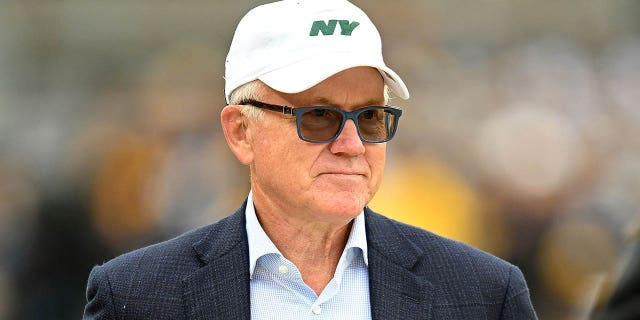 New York Jets owner Woody Johnson looks on before a game against the Pittsburgh Steelers at Acrisure Stadium on October 2, 2022, in Pittsburgh, Pennsylvania.