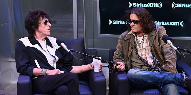 Johnny Depp and Jeff Beck sit for an interview at the SirusXMs Town Hall in New York City and look at each other in conversation