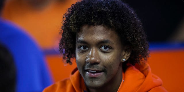 Jaden Rashada watches a game between the Florida Gators and the South Carolina Gamecocks at Ben Hill Griffin Stadium on November 12, 2022 in Gainesville, Florida.