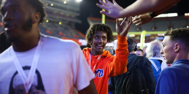 Jaden Rashada watches during the second half of a game between the Florida Gators and the South Carolina Gamecocks at Ben Hill Griffin Stadium on November 12, 2022 in Gainesville, Florida.