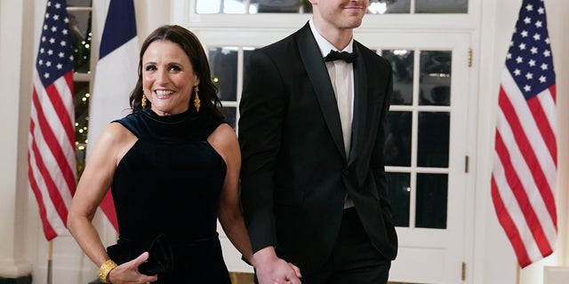 Actress Julia Louis-Dreyfus and her son Charlie Hall arrive for the White House state dinner in Dec. 2022.