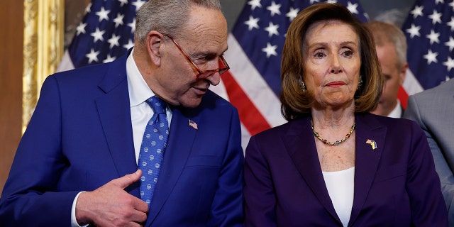 House Speaker Nancy Pelosi, D-Calif., speaks with Senate Majority Leader Chuck Schumer, D-NY, at the U.S. Capitol Building on Dec. 8, 2022 in Washington, D.C. 