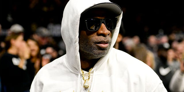 Colorado Buffaloes football coach Deion Sanders arrives for a basketball game against the Colorado State Rams in Boulder on December 8, 2022. 