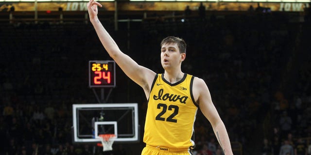 Iowa Hawkeyes forward Patrick McCaffery, #22, celebrates a basket during the first half against the Wisconsin Badgers at Carver-Hawkeye Arena on December 11, 2022 in Iowa City, Iowa.