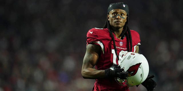 DeAndre Hopkins #10 of the Arizona Cardinals gets set against the New England Patriots at State Farm Stadium on December 12, 2022 in Glendale, Arizona.