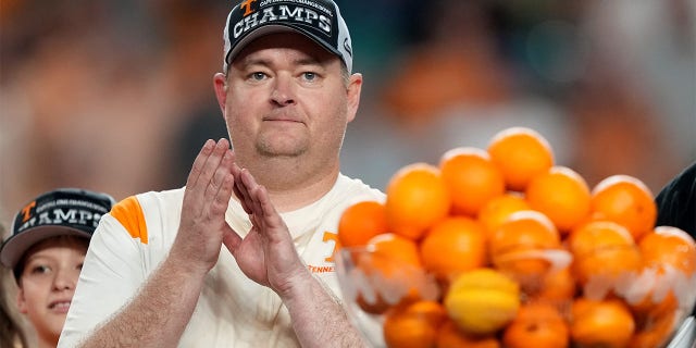 Head coach Josh Heupel of the Tennessee Volunteers celebrates on stage after defeating the Clemson Tigers in the Capital One Orange Bowl at Hard Rock Stadium on December 30, 2022 in Miami Gardens, Florida. 