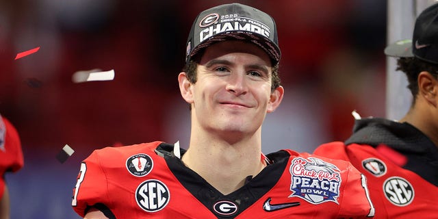 The Georgia Bulldogs celebrate after defeating the Ohio State Buckeyes in the Chick-fil-A Peach Bowl on Dec. 31, 2022, in Atlanta.